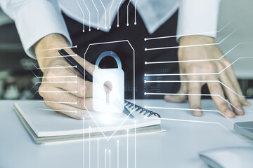 Poster - Creative idea concept with lock symbol and microcircuit illustration and hand writing in notebook on background with laptop. Protection and firewall concept. Multiexposure