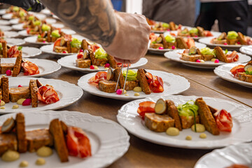 Canvas Print - Chef decorating a starter plate