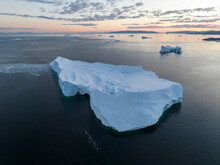 Aerial Drone View Of A Huge Iceberg At The Ilulissat Ice Fjord Lagoon In Greenland At Morning Blue Hour, Arctic.