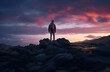 © Cheport - Rear view of the hiker on top of the mountain at sunset.