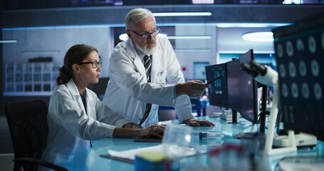 Poster - Biotechnology Research Laboratory: Female Asian Doctor Working With Test Tubes To Study Effect Of Innovative Alzheimer's Medicine. Focus Shifting To Colleagues Discussing CT Brain Scans On Computer.