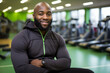 portrait of muscular African American man resting in gym while looking at camera. Healthy lifestyle