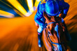 Jockey on racing horse. Champion. Hippodrome. Racetrack. Horse riding. Derby. Speed. Blurred movement.  
