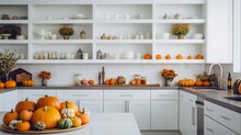 White Modern Kitchen Decorated For Fall With Orange Pumpkins., Copy Space, 16:9