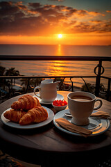 cup of coffee and french croissant on table, balcony with view of beautiful landscape, still life, sea and mountains, resort town, sunset