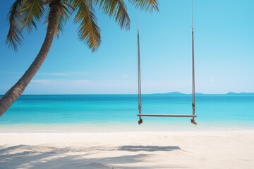 Wall Mural - A lonely empty swing with palm tree at sand beach with blue sea. Summer tropical vacation concept.