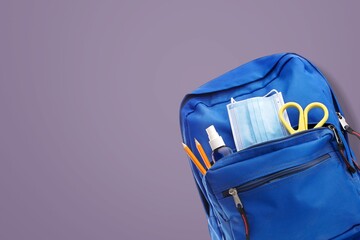 Poster - Opened colored School backpack with set of stationery