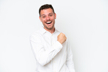 Poster - Young caucasian handsome man isolated on white background celebrating a victory