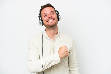 Poster - Telemarketer caucasian man working with a headset isolated on white background celebrating a victory