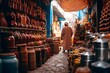 A man walks through the narrow streets of Marrakech, Morocco.