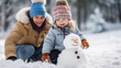 © Julia Zarubina - child makes a snowman in winter, childhood, white snow, kid, toddler, childhood, outdoor fun, new year, holidays, christmas, family, walk in the park, parents, together, happy, smile, love, dad, joy