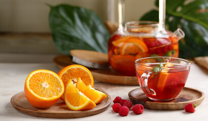 Canvas Print - fruit berry citrus tea in a glass teapot