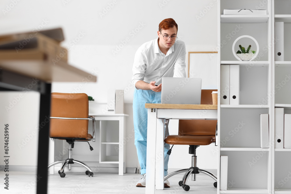 Young businessman working in office