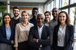 © Bojan - Happy diverse professional business team stand in office looking at camera, smiling young and old multiracial workers staff group pose together as human resource, corporate equality concept