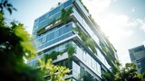 Fototapeta Kosmos - Eco-friendly building modern city sustainable glass building Ecology concept Office building with green environment