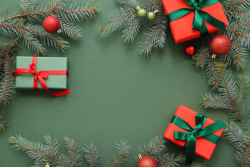 Wall Mural - Frame made of Christmas gift boxes with fir branches and balls on green background