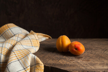 Apricots on wooden background..