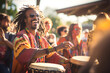 African hippy man playing percussion in a party