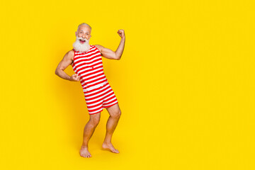 Canvas Print - Full length photo of overjoyed positive person raise fists shout yeah hooray empty space isolated on yellow color background