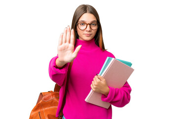 Poster - Teenager student caucasian girl over isolated background making stop gesture