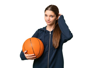 Wall Mural - Teenager caucasian girl playing basketball over isolated background having doubts