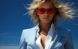 Woman in close fitting cobalt suit with white unbuttoned shirt. Fashion photography.