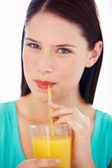 Poster - Health, drink and portrait of woman with juice for nutrition, wellness and hydration in studio. Happy, thirsty and face of person with fruit blend for vitamins, detox and diet on white background