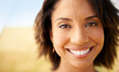 © Jeff Bergen/peopleimages.com - Portrait, freedom or happy woman in an outdoor field in the countryside in spring to relax on break. Smile, wellness or female person in farm for fresh air on holiday vacation or travel in nature
