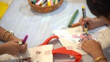 Kindergarten Kid Coloring DIY Tote Bag With Markers In The Classroom, Little Child Enjoys Doing Arts And Crafts Projects At School On Nature. 