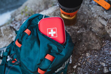 First Aid Kit Is In The Top Pocket Of The Backpack, Survival In The Woods, Camping In Nature, Safety On A Hike.