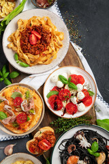 Poster - Italian food dishes on dark background. Traditional food concept.