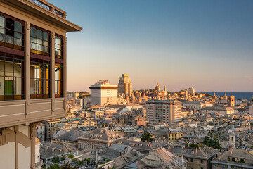 Wall Mural - Aerial view of the downtown of Genoa at the sunset seen from Castelletto with famous public elevator