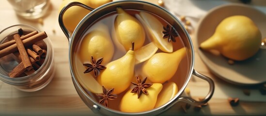 From above saucepan with delicious poached pears in white wine at table near star anise and jar with juice