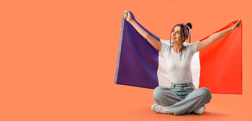 Poster - Young woman holding flag of France on orange background with space for text