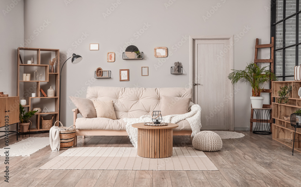 Interior of light living room with couch and coffee table Stock Photo ...