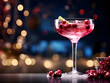 Delicious red winter cranberry cocktail with ice on table with dark blurred lights background 