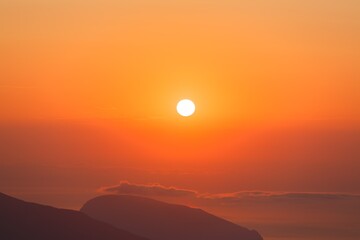 Wall Mural - Beautiful mountain landscape with sunset sky with sea