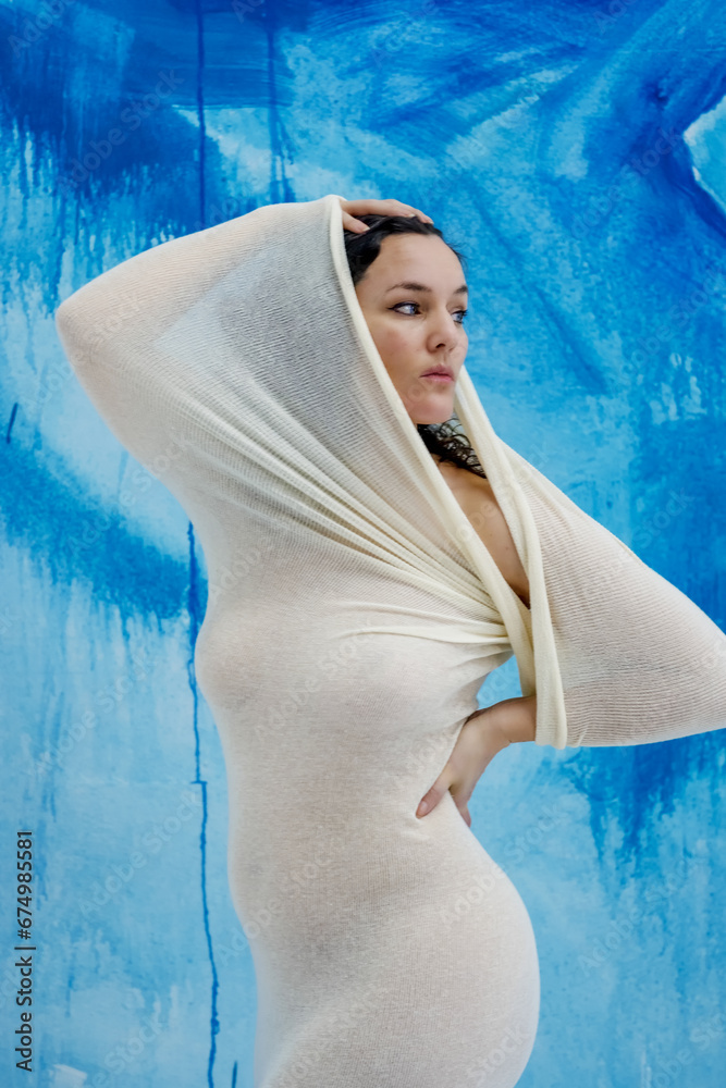 sexy young nude woman in white transparent cotton stocking dress in the