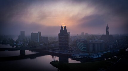 Wall Mural - Aerial view of Roermond cityscape at foggy sunset in Netherlands
