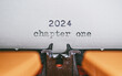 Old Typewriter with following text on paper - 2024 Chapter one. new years concept