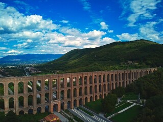 Wall Mural - View of a Carolina aqueduct with green hills in the background