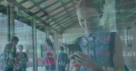 Sticker - Animation of multicolored trading board over caucasian girl using smartphone at school