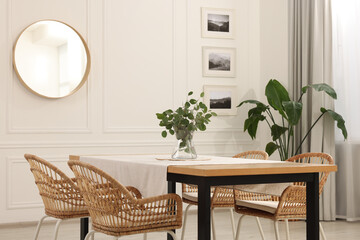 Canvas Print - Stylish dining room with cozy furniture, mirror and plants