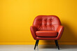 Modern red armchair on yellow background. 
