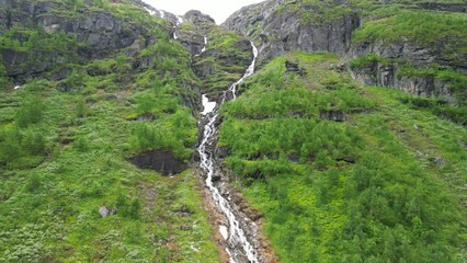 Poster - Drone footage over Nyastolfossen Waterfall landscape in Norway with forest trees