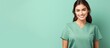 beautiful woman wearing medical scrubs, isolated on Green background. Place holder, copy space banner for medical and beauty industry