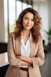 © piai - Successful smiling business lady wearing fashion suit in the office looking at the camera