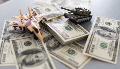 Wall Mural - Tank on dollar bills. The concept of war costs, military spending.