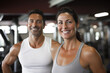© zamuruev - couple fitness man and woman in sportswear standing in gym club. personal trainer. healthy lifestyle