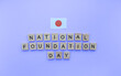 © Svetlana Leuto - February 11, National Foundation Day, flag of Japan, minimalistic banner with wooden letters on a blue background